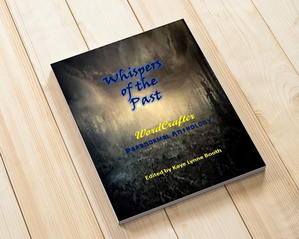 Wood background with Whispers of the PAst laying on top.
Book Cover: A dark and msty or foggy forest.
Text: Whispers of the Past, WordCrafter Paranormal Anthology, Edited by Kaye Lynne Booth
