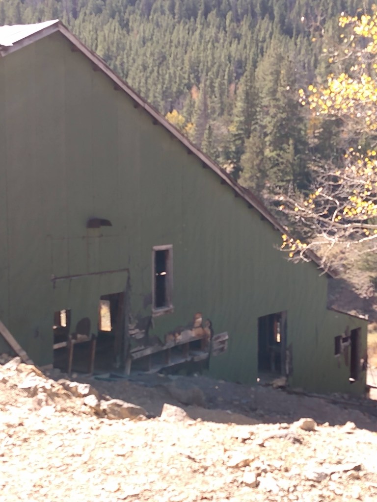 Side view of mostly intact part of stamp mill.