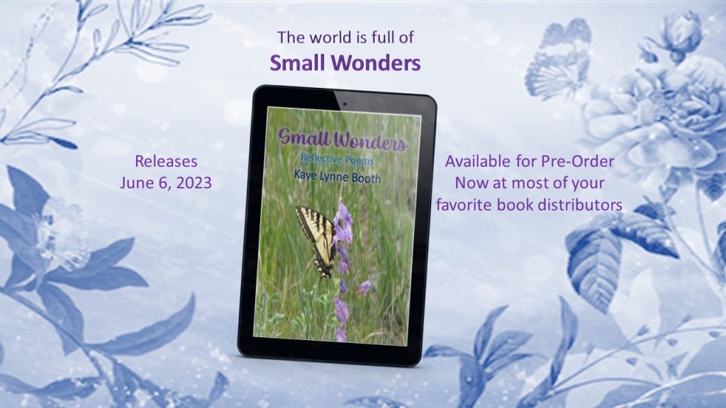 Bluish, flowery and leafy background with Small Wonders on a digital device in the forefront.
Text: The world is full of Small Wonders, Releases June 6, 2023, Available for Pre-Order Now at most of your favorite distributors.
