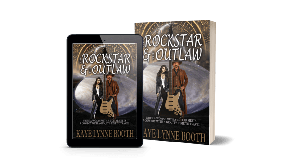 Digital and Print Copies of The Rock Star & The Outlaw
Book Cover: Sundial and planet in the background. Black leather clad woman and Man dressed in western garbstand beind giant electric guitar in foreground.
Text: The Rock Star & The Outlaw, When a women with a guitar meets a cowboy with a gun, it's time to travel, Kaye Lynne Booth