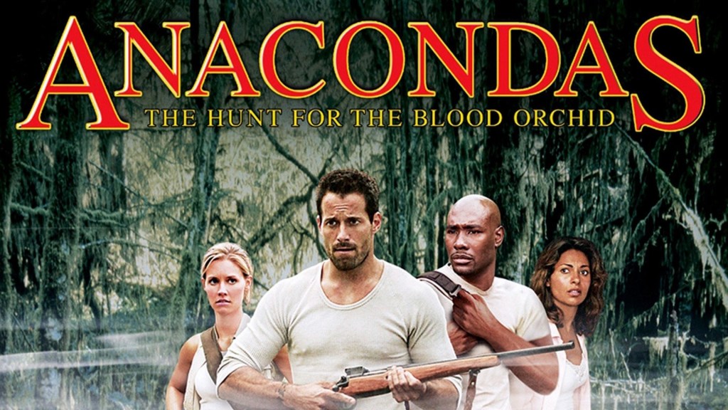 Four people carrying packs and a rifle in a jungle
Text: Anacondas, The Hunt for the Blood Orchid