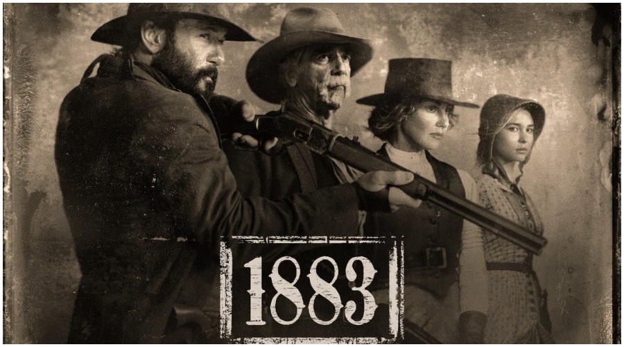 Two men and two women, all in western garb. One man holding a shotgun.
Text: 1883