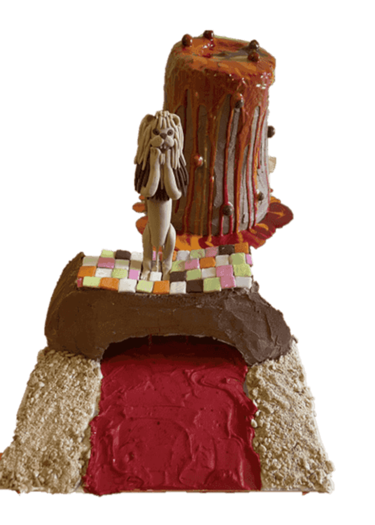 Cake decorated with fondant art: Mountain with a distressed lion on top