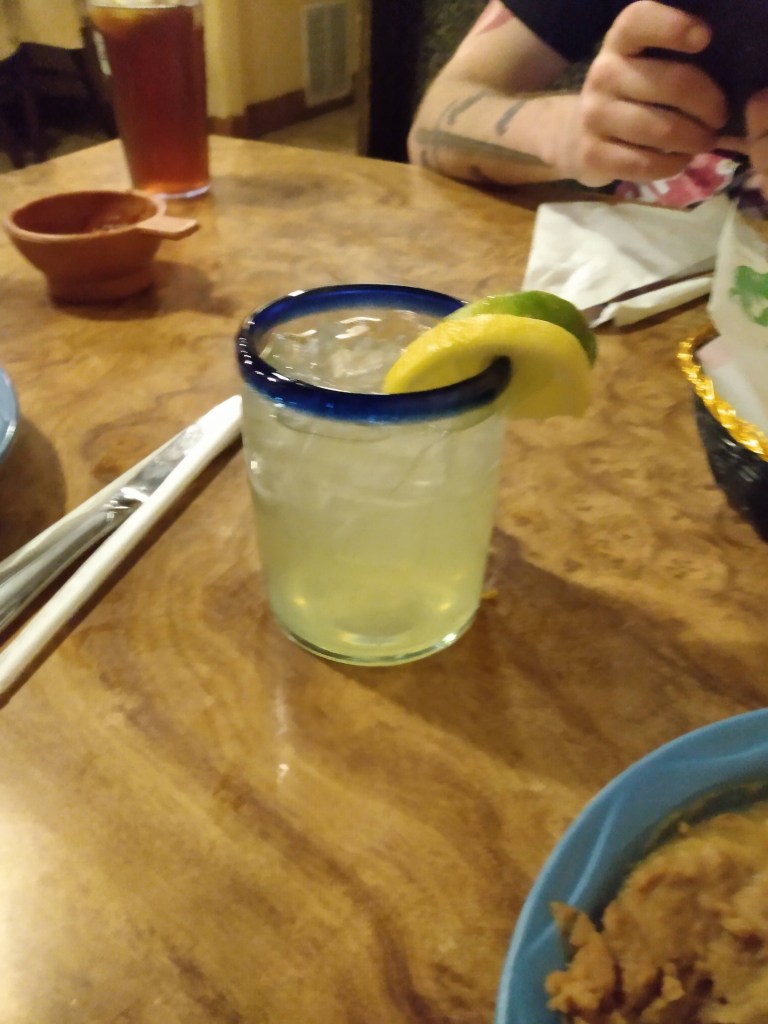 Margarita with lemon and lime garnish