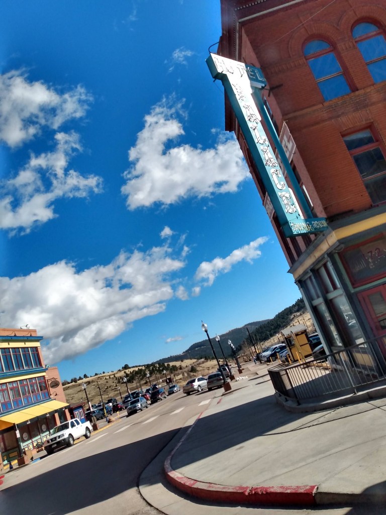 Blue sky between buildings on a Cripple Creek street