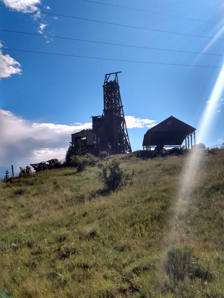 Old mill equipment with blue sky in the background