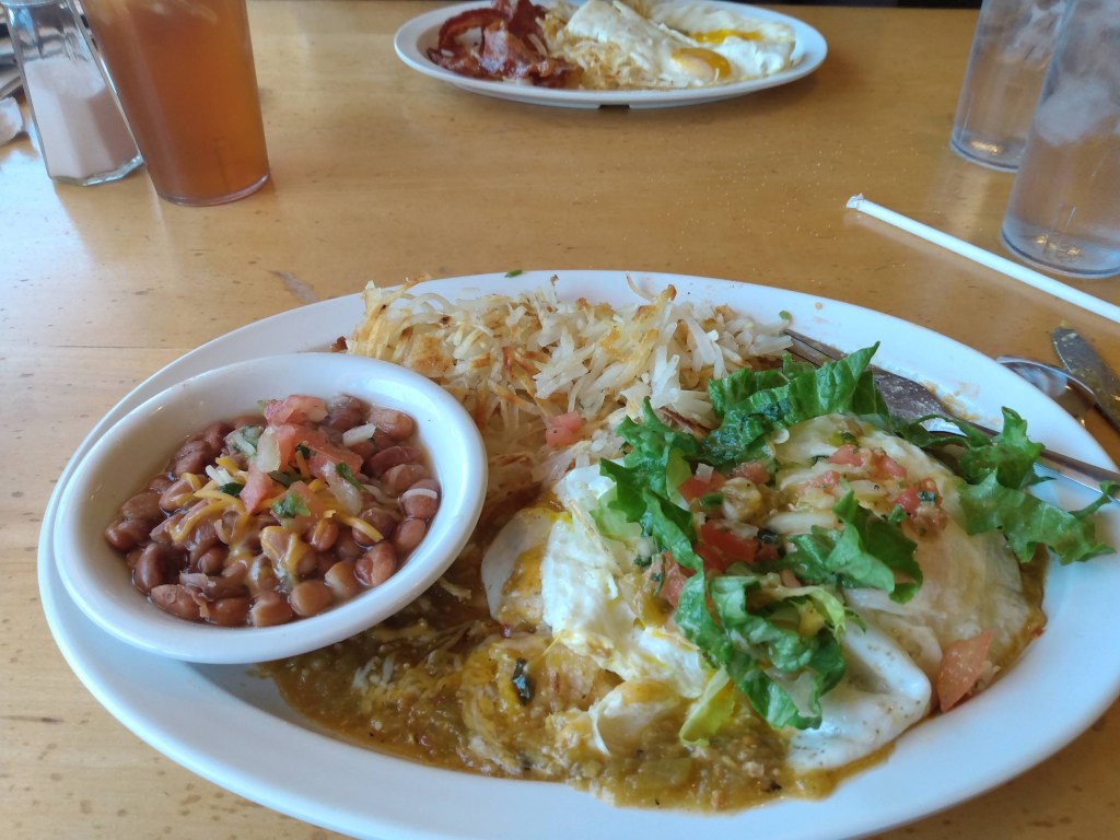 Mexican breakfast plate with brown beans and hash browns