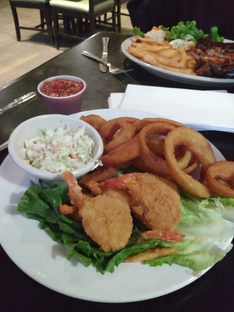 Shriimp and onion rings with cole slaw