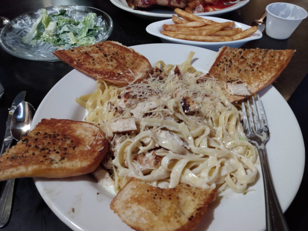 Chicken fettucinni with golden brown garlic bread