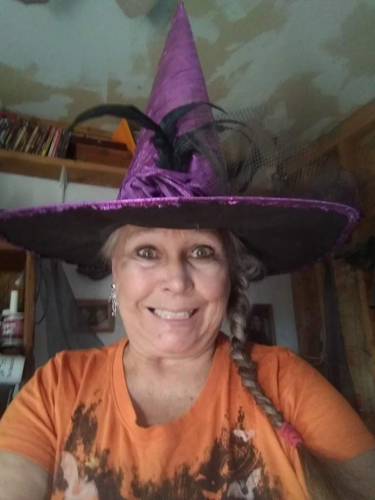Me in my orange Halloween shirt and purple witch's hat