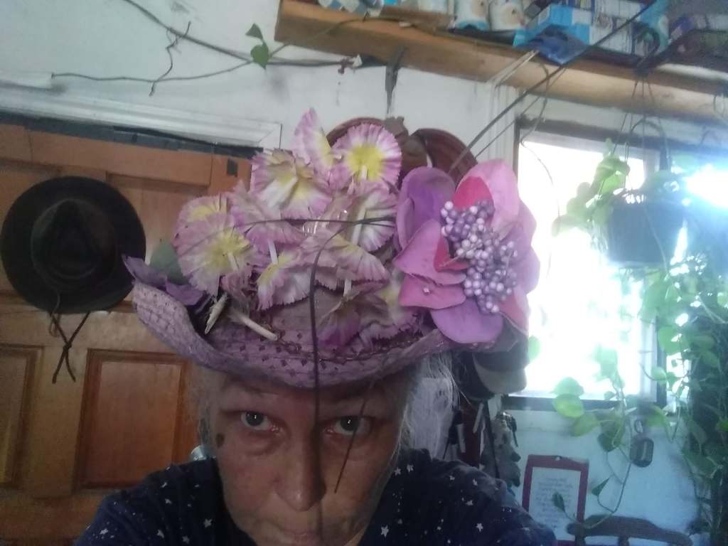 Purple Cowboy Hat Adorned with Purple Flowers