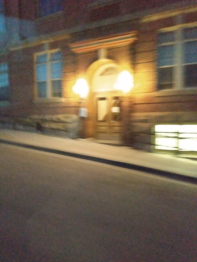 Arched doorway of the Cripple Creek Courthouse at night
